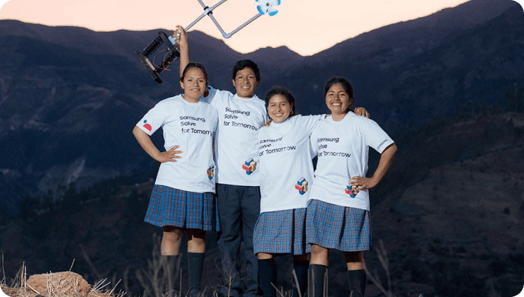 Samsung Solve for Tomorrow winners putting arms around each other