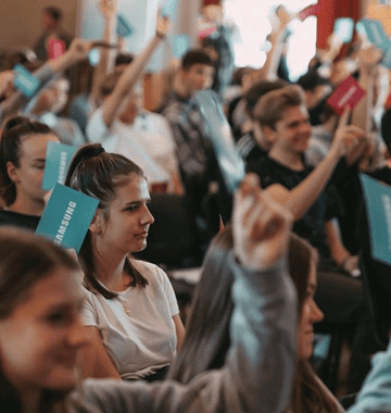 Youth holding a paper with 'SAMSUNG' written on it