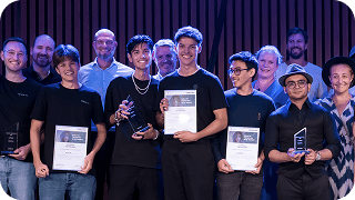 The winning students of Samsung Solve for Tomorrow in Germany are taking a group photo together while holding souvenirs
