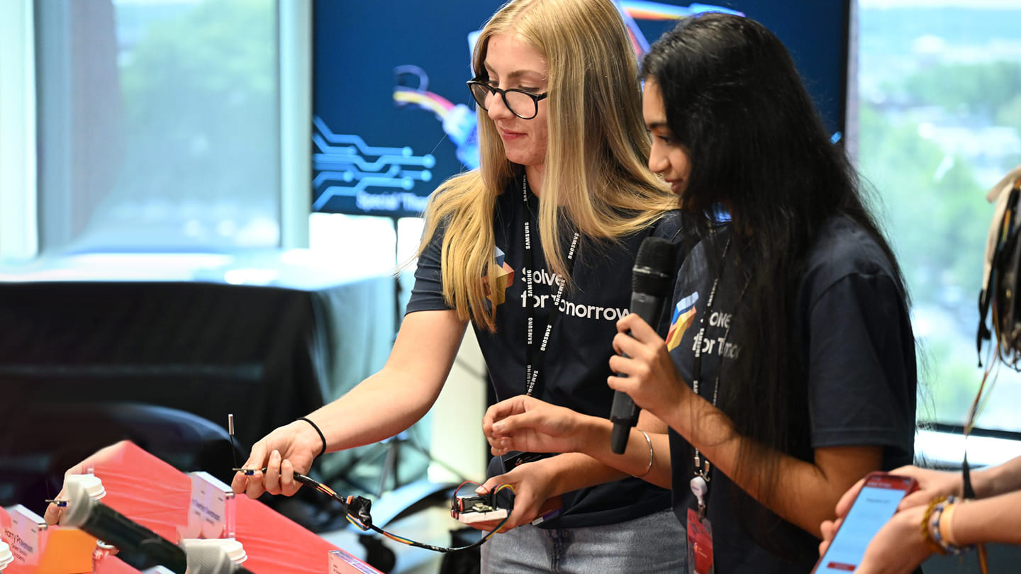 Students participating in Samsung Solve for Tomorrow are demonstrating their projects in front of judges.