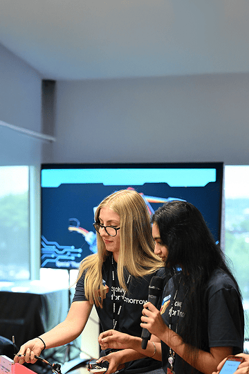 Students participating in Samsung Solve for Tomorrow are demonstrating their projects in front of judges.